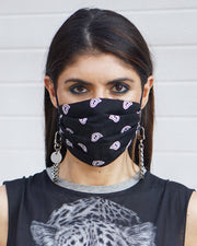 Stylish silver necklace being worn around the neck with face mask by girl